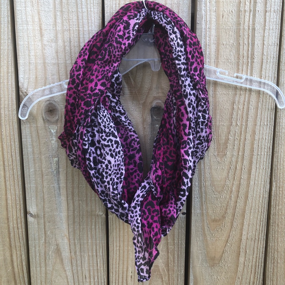Pink and white animal print scarf .